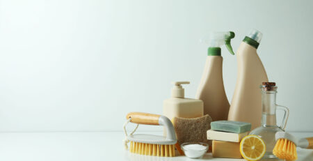 Cleaning concept with eco friendly cleaning tools on white table